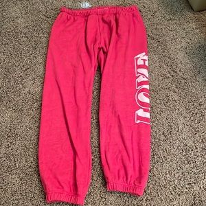 These are red spiritual gangster capri sweatpants